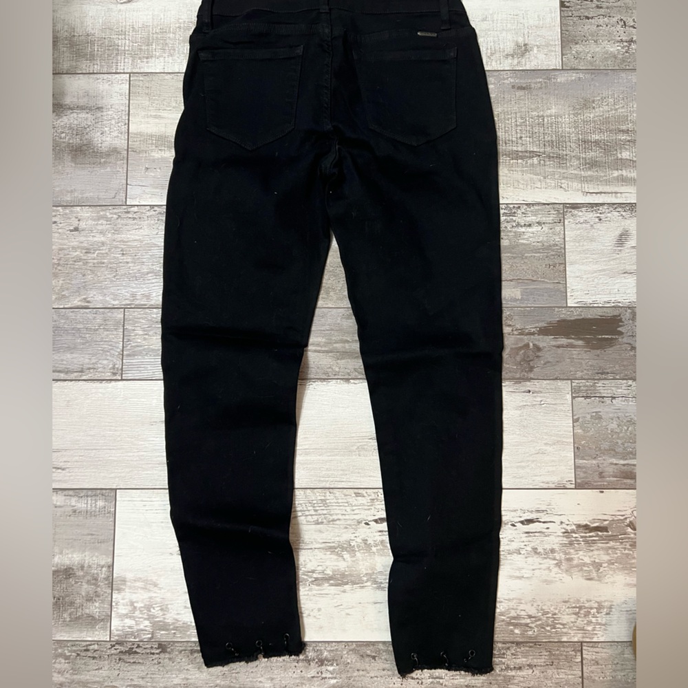Kan Can size 9/28 Women's Black Jeans with stylish frayed angled end.